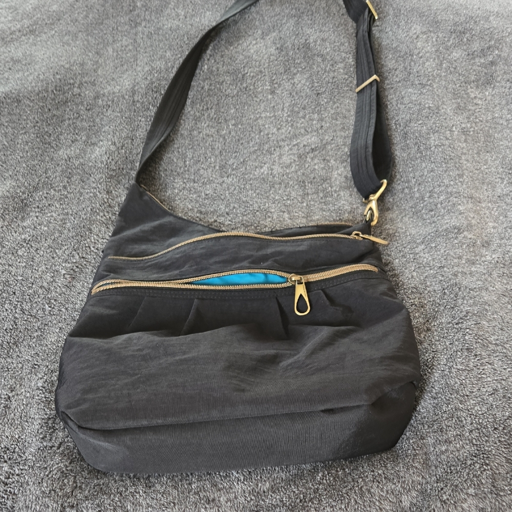 Travelon Stylish Black Crossbody Bag with Gold Zippers,